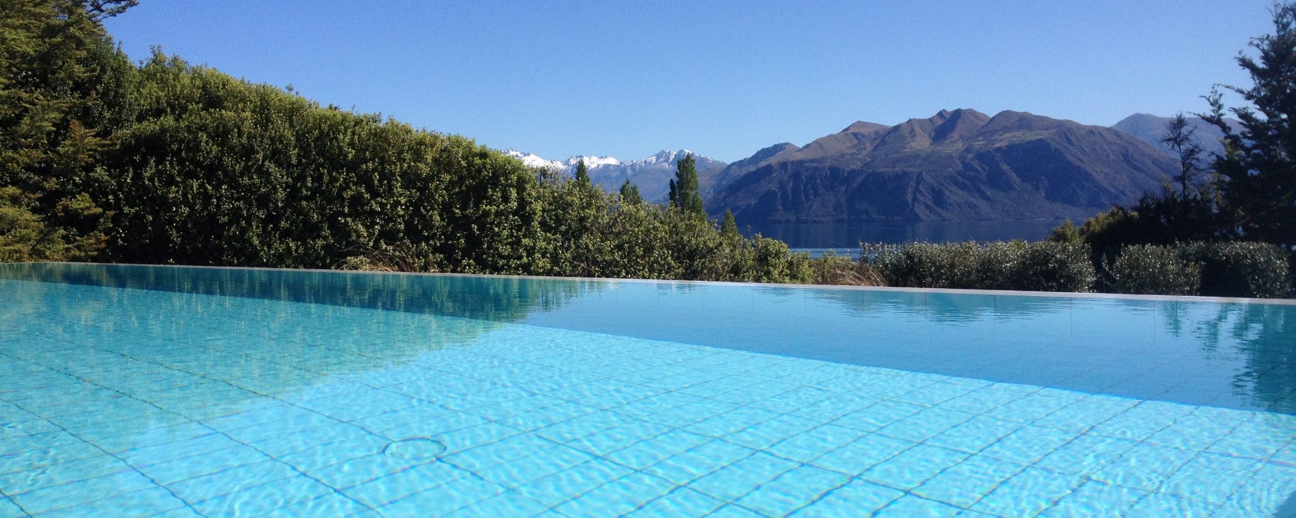 Aspiring Pools & Spas - Beautiful crystal blue infinity pool overlooking Lake Wanaka